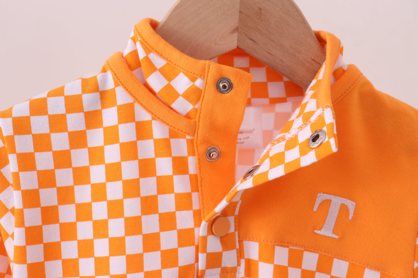 Orange Tennessee checkered pullover ruffle top